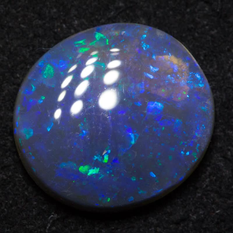 3.20 ct black opal 12x11x4mm
