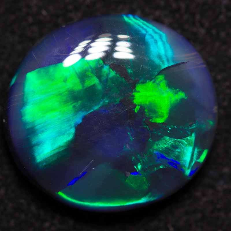 3.25 ct black opal 12x11x4mm