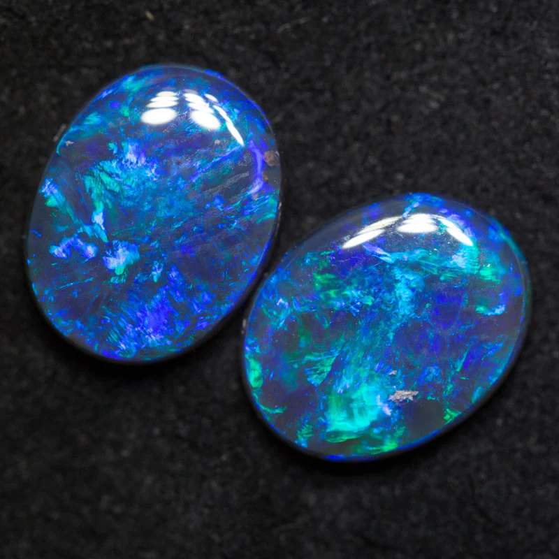 3.30 ct black crystal opal pair 9.7x7.6x3.1mm