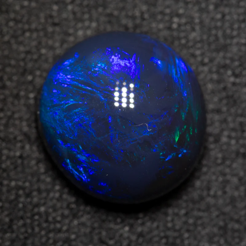3.92 ct black opal 10.5x9.9x6.4mm