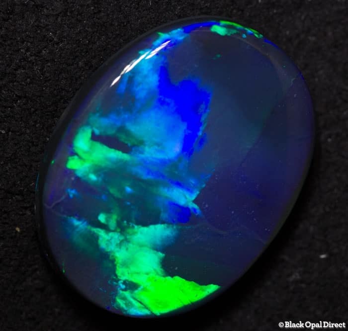 4.45 ct black opal with broad flash 14x11x4mm