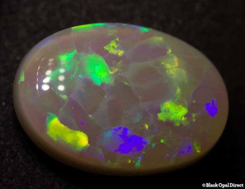 4.61 ct harlequin semi black opal 15x10x4mm