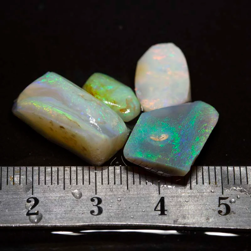 43.00 ct rough and rubbed opal parcel 4pc