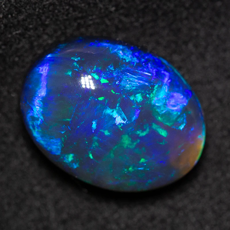 5.61 ct black opal 13.3x10.2x6.8mm