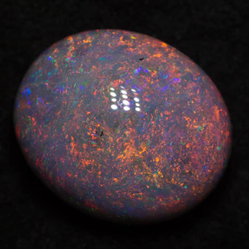 5.65 ct dark opal 12.7x10.8x6.8mm