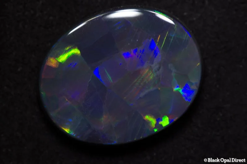 5.67 ct harlequin black opal 16x13x4mm