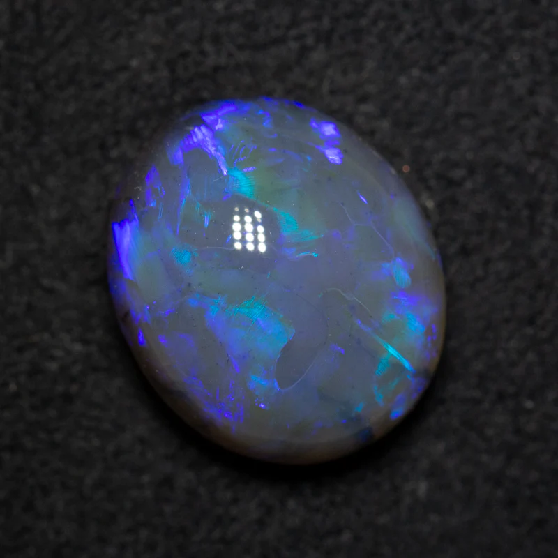 5.84 ct black opal 12.7x10.8x7.5mm