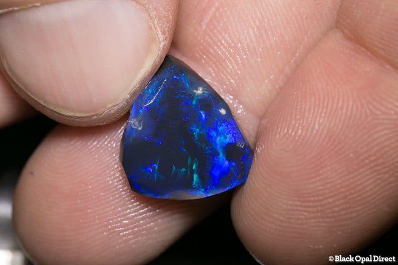 6.07 ct black opal rubbed piece 15mm across