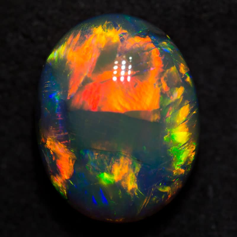 6.44 ct gem black opal 13.4x10.5x7.6mm