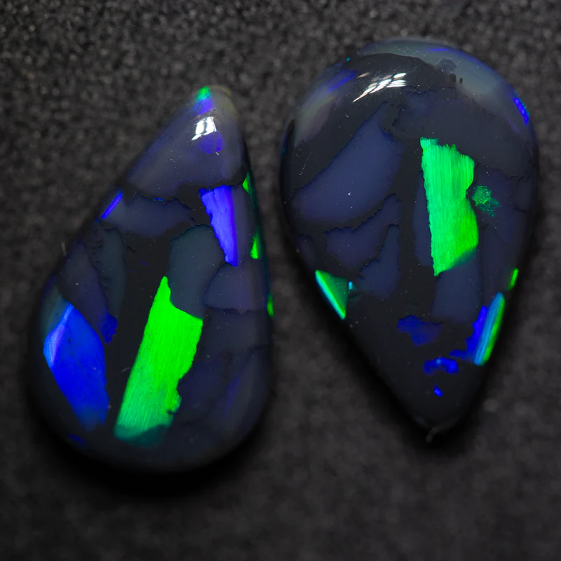 6.95 ct gem black opal pair 14.3x9.5x4.4mm