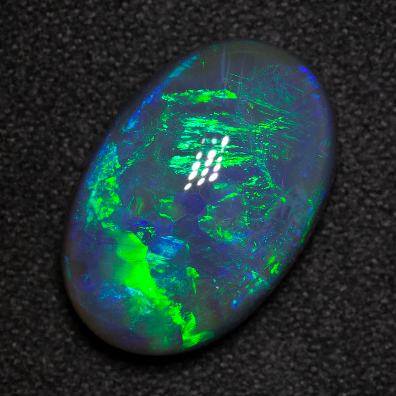 7.00 ct black opal 15.9x10.8x6.4mm