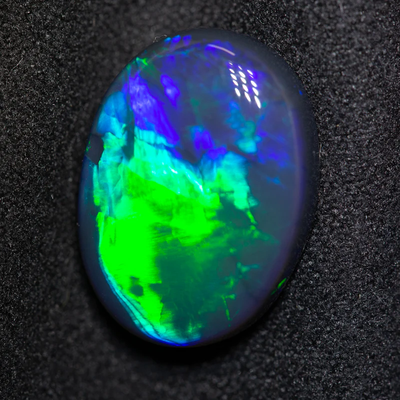 7.05 ct black opal 16.6x12.4x5.4mm