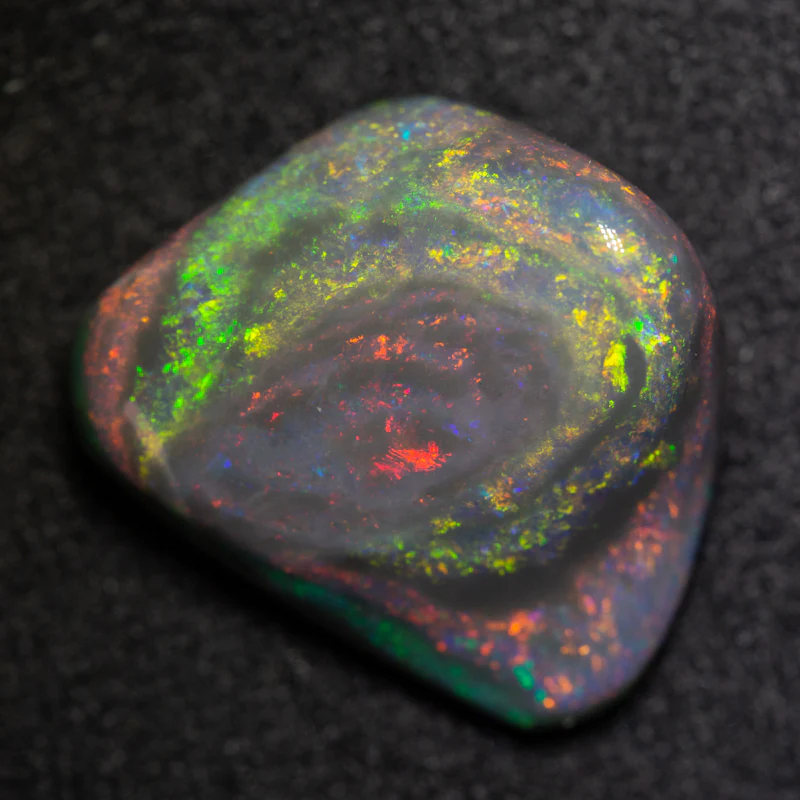 7.19 ct black opal carving 15.2x12.9x6.8mm