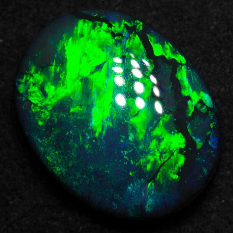 7.67 ct black opal 15.8x12.6x5.8mm