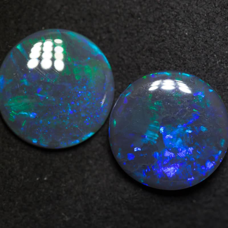 7.67 ct black opal pair 13.2mm round x 3.3mm