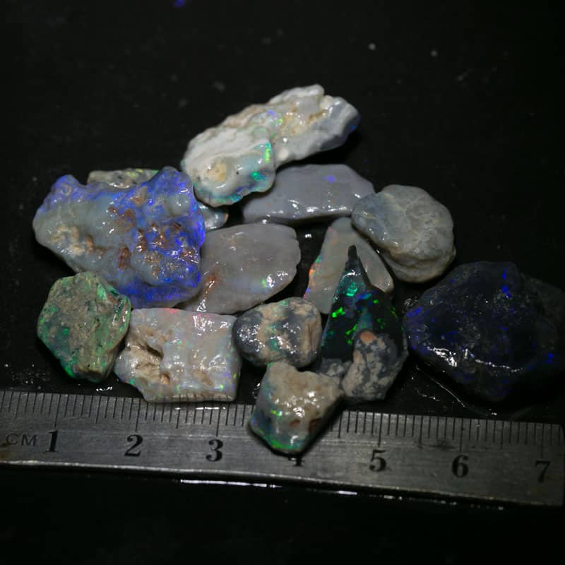 82 ct  13pc rough opal parcel for intermediate cutters