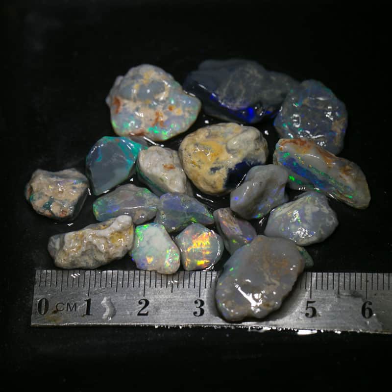 85 ct  17pc rough opal parcel for intermediate cutters