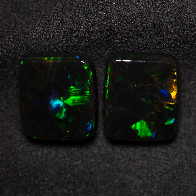 9.15 ct black opal pair 12.1x10.5x4.2mm
