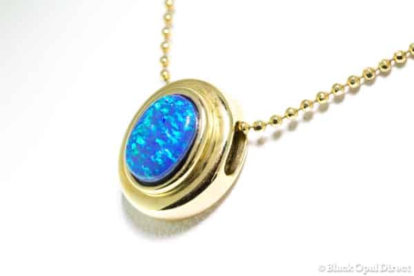 Gold Ningaloo pendant with black opal doublet
